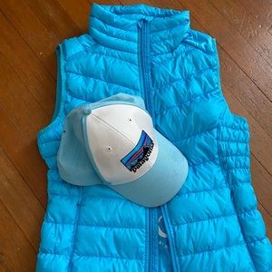 Womens blue down feather puffer vest and Patagonia snap back hat